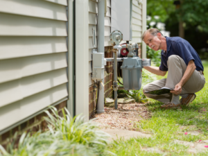 licensed plumber inspecting gas meter in Akron, Ohio