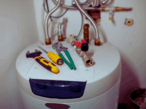 tools on top of hot water heater ready to be replaced 