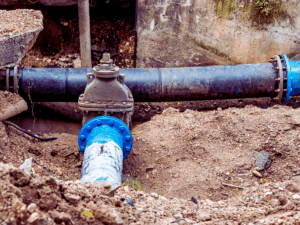 Underground water line dug up by plumbing company