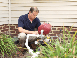 Plumber inspecting well pump to see how much longer it will last